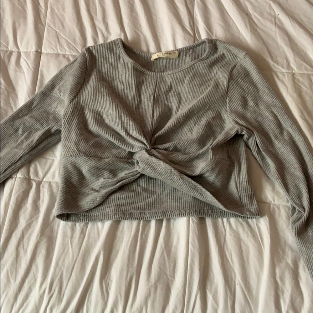 A gray sleeved crop top.